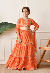 Girls Bright Orange Bandhani Printed Lehenga Choli Set with Net Dupatta