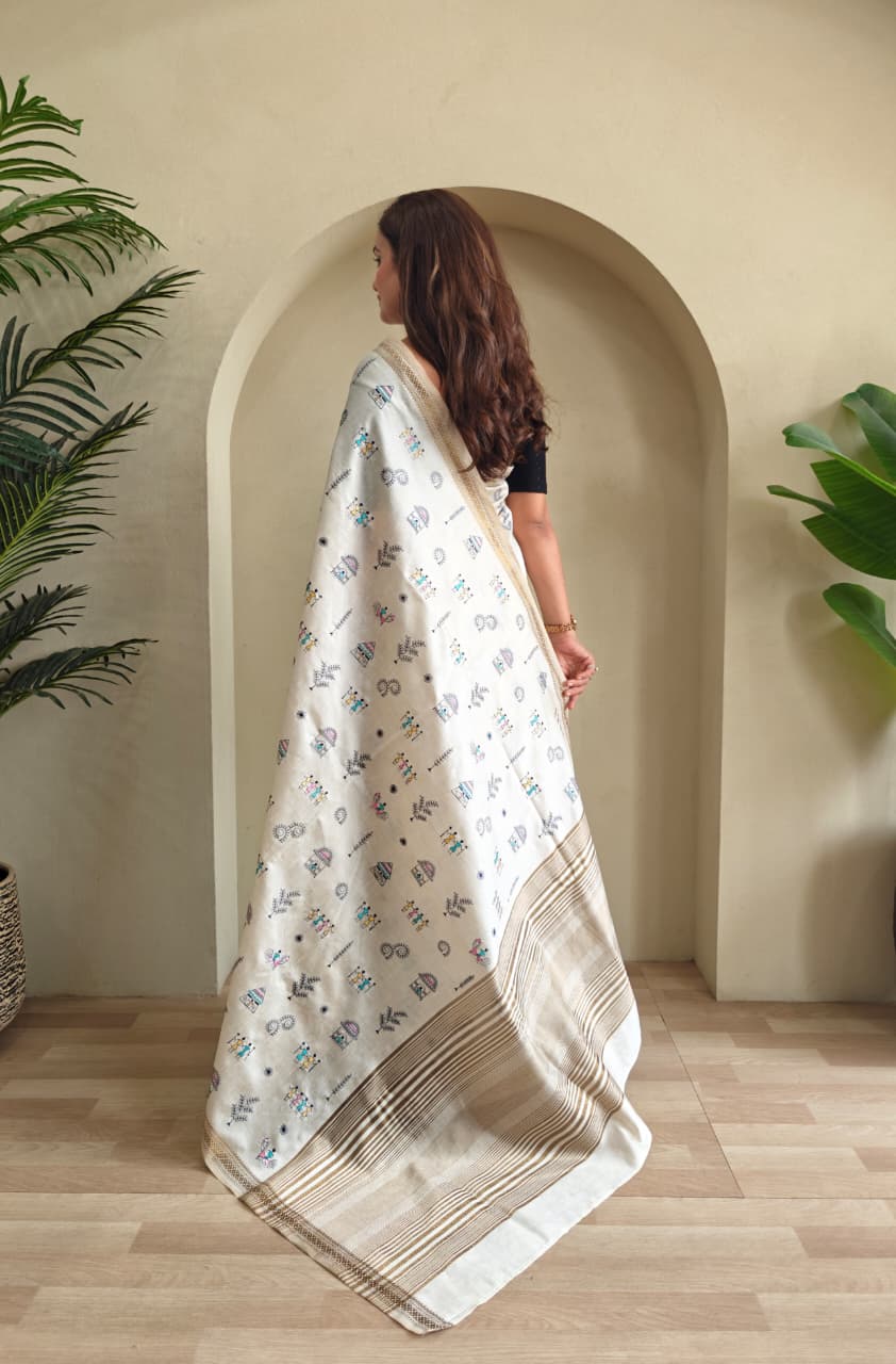 PURE LOOM TUSSAR SAREE WITH ALL OVER WORLI EMBROIDERY PATTERN,  COPPER ZARI BORDER AND ZARI WOVEN PALLU.